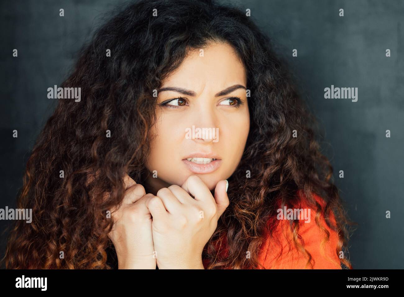 young woman worried concerned fear anxiety Stock Photo