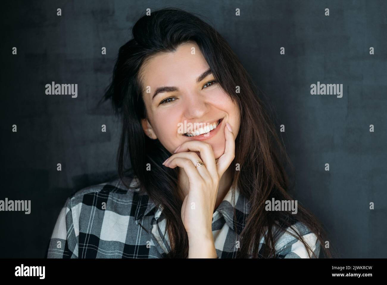 cheerful young brunette smiling inquisitive lady Stock Photo