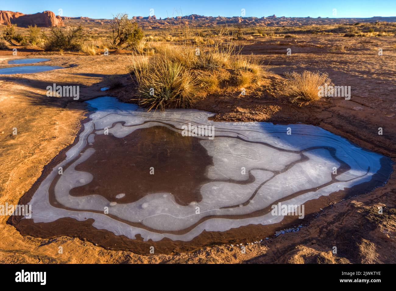Frozen snowmelt in a pothole in the Navajo sandstone in the Courthouse