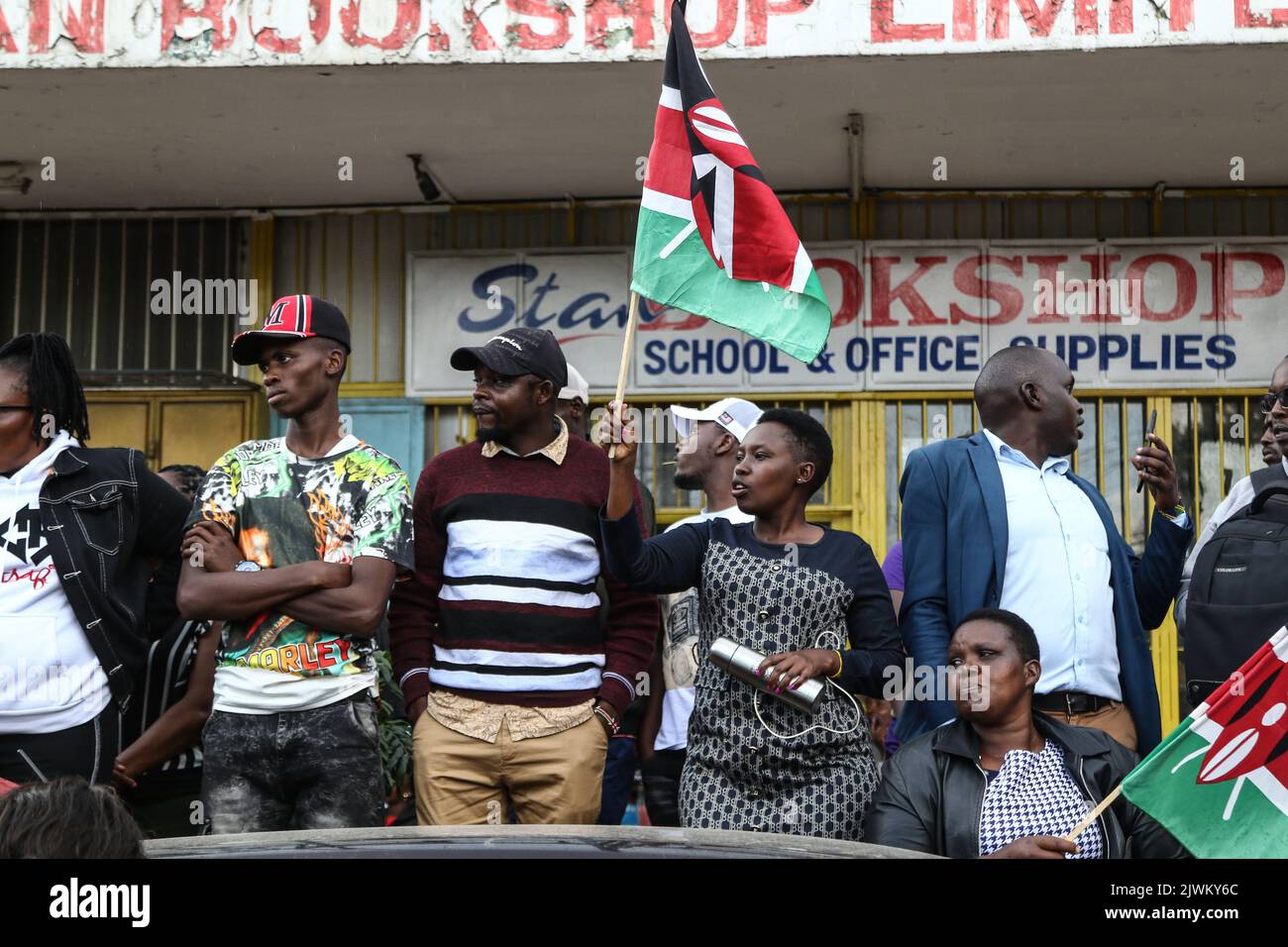 A Ruto supporter waves a Kenyan flag following the Supreme Court's