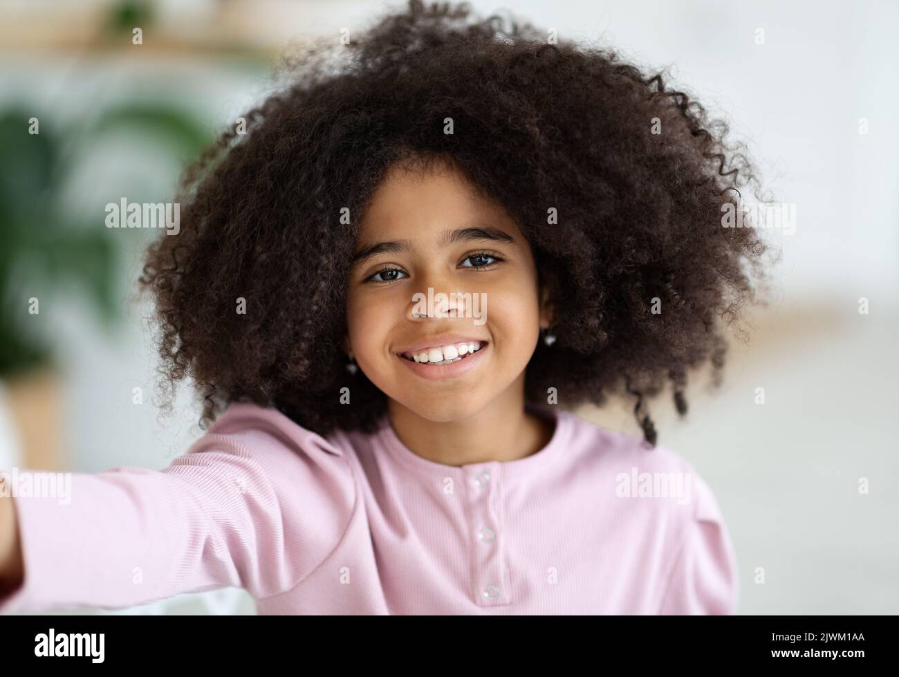 Closeup portrait of happy african american girl taking selfie Stock ...