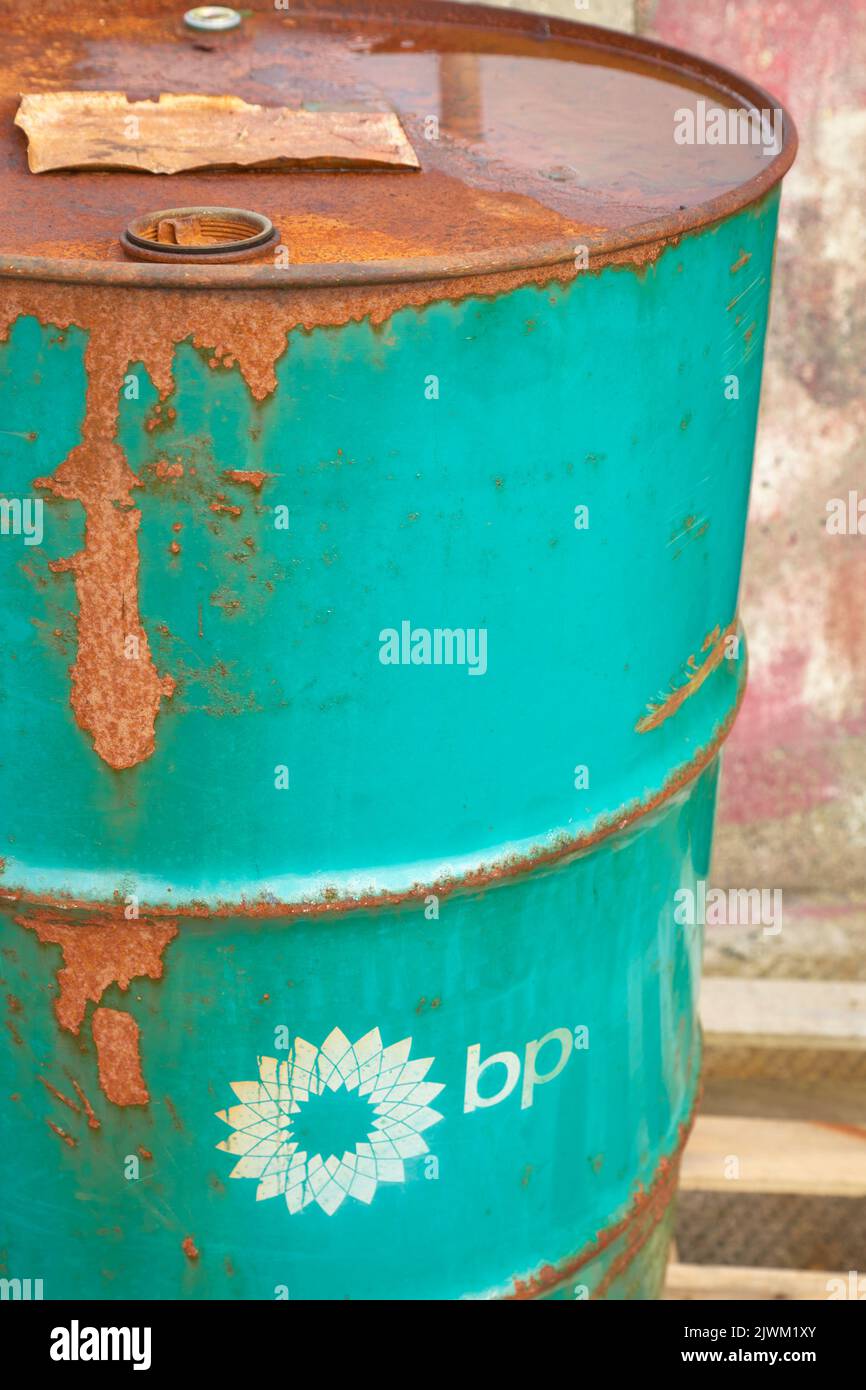 Rusty green BP oil drum in Scotland, UK Stock Photo