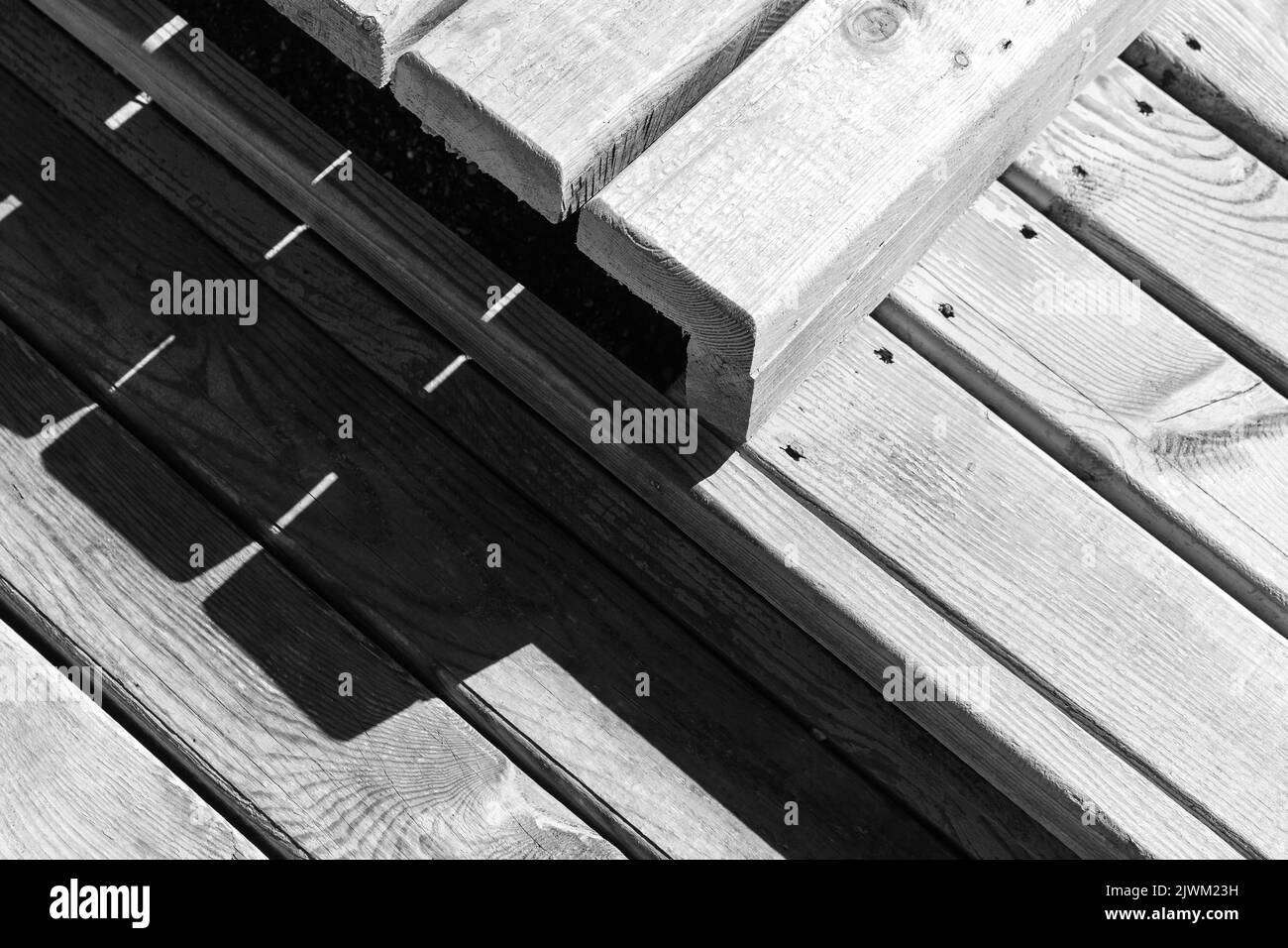 Abstract wooden construction fragment, exterior details made white boards with strong shadows Stock Photo