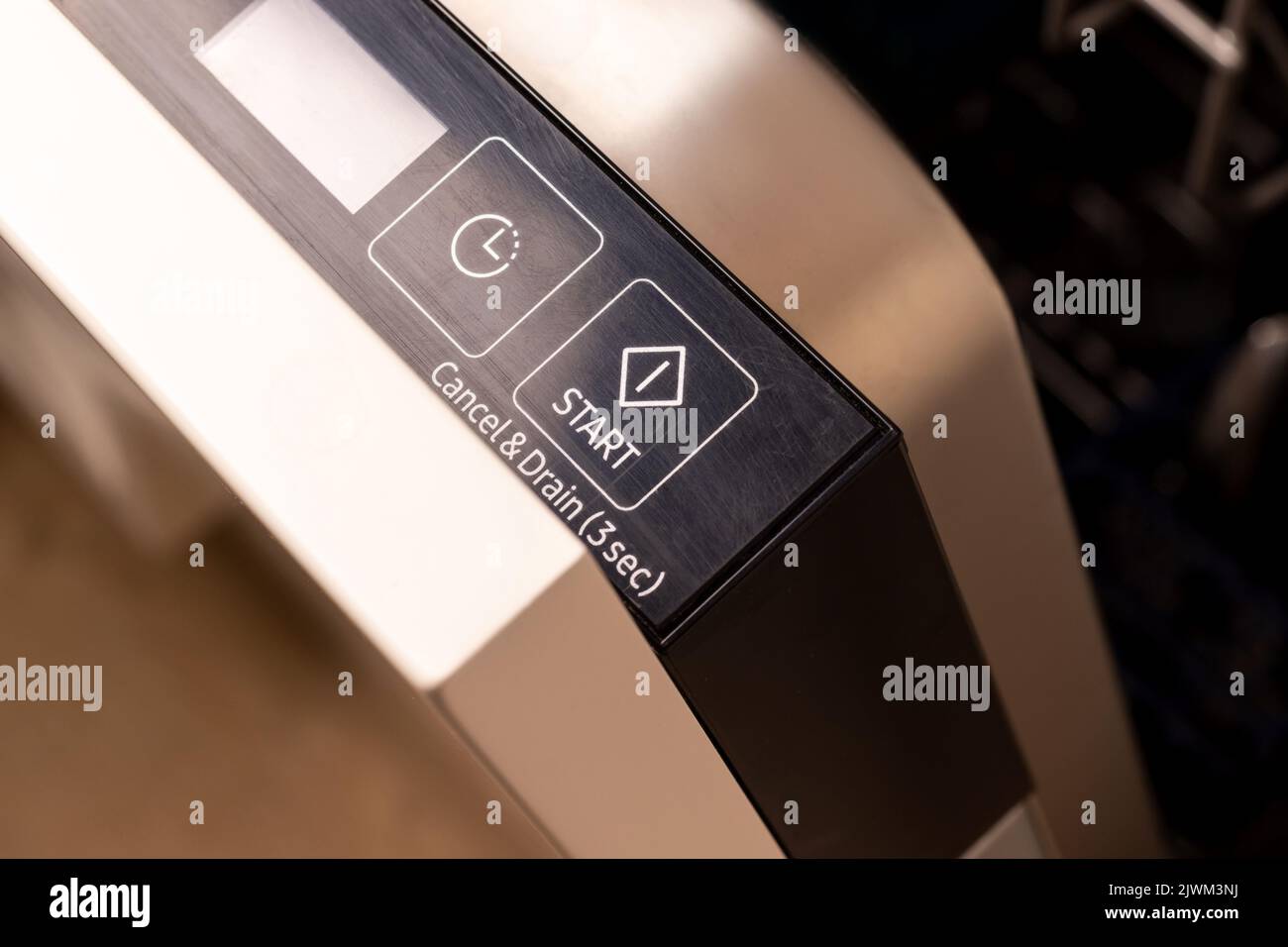 Modern dishwasher start button on control panel closeup Stock Photo Alamy