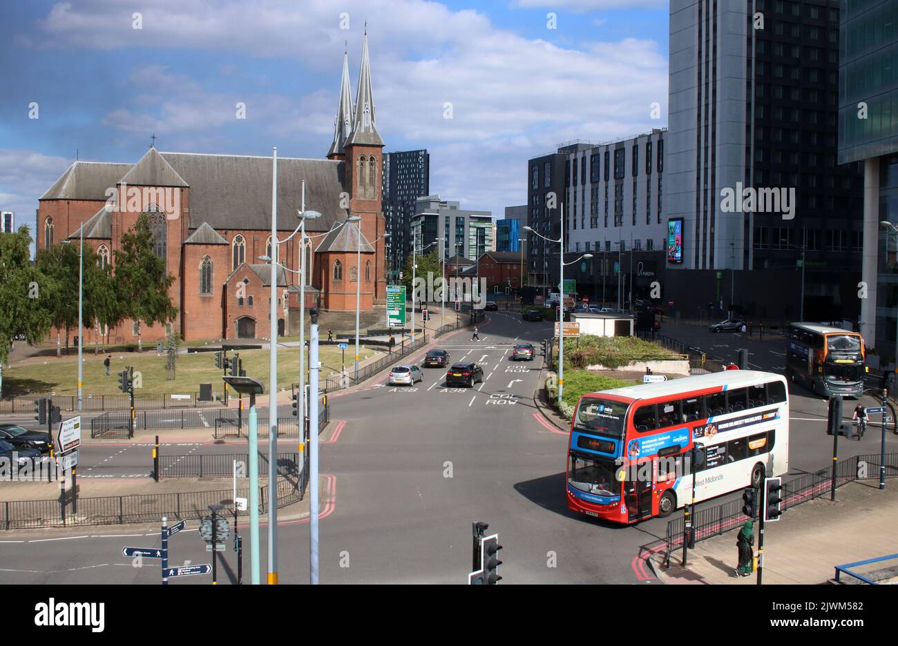 Metropolitan Cathedral Church and Basilica of Saint Chad, Catholic cathedral in Birmingham with buses and traffic on St Chad's Queensway, Birmingham. Stock Photo