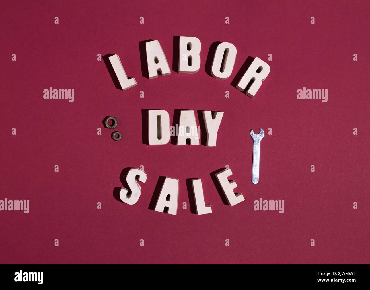 Labor day sale banner, colorfull paper background, white concrete