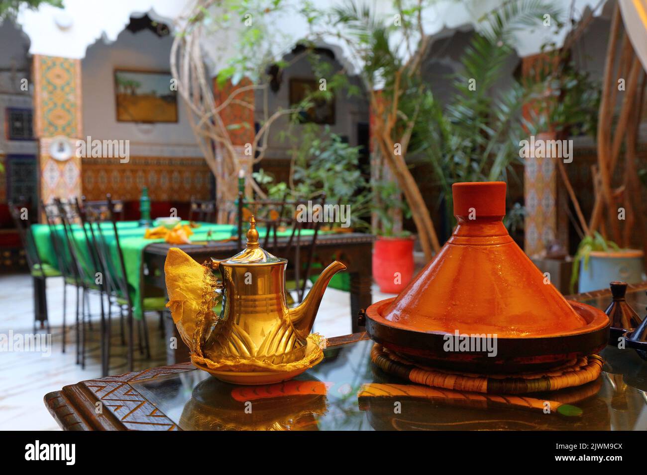 Moroccan teapot and traditional tagine cooking dish in a hotel in