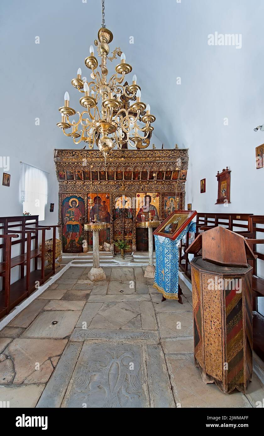 The traditional interior of the unidentified orthodox church in Naoussa village of Paros island in Greece. Stock Photo