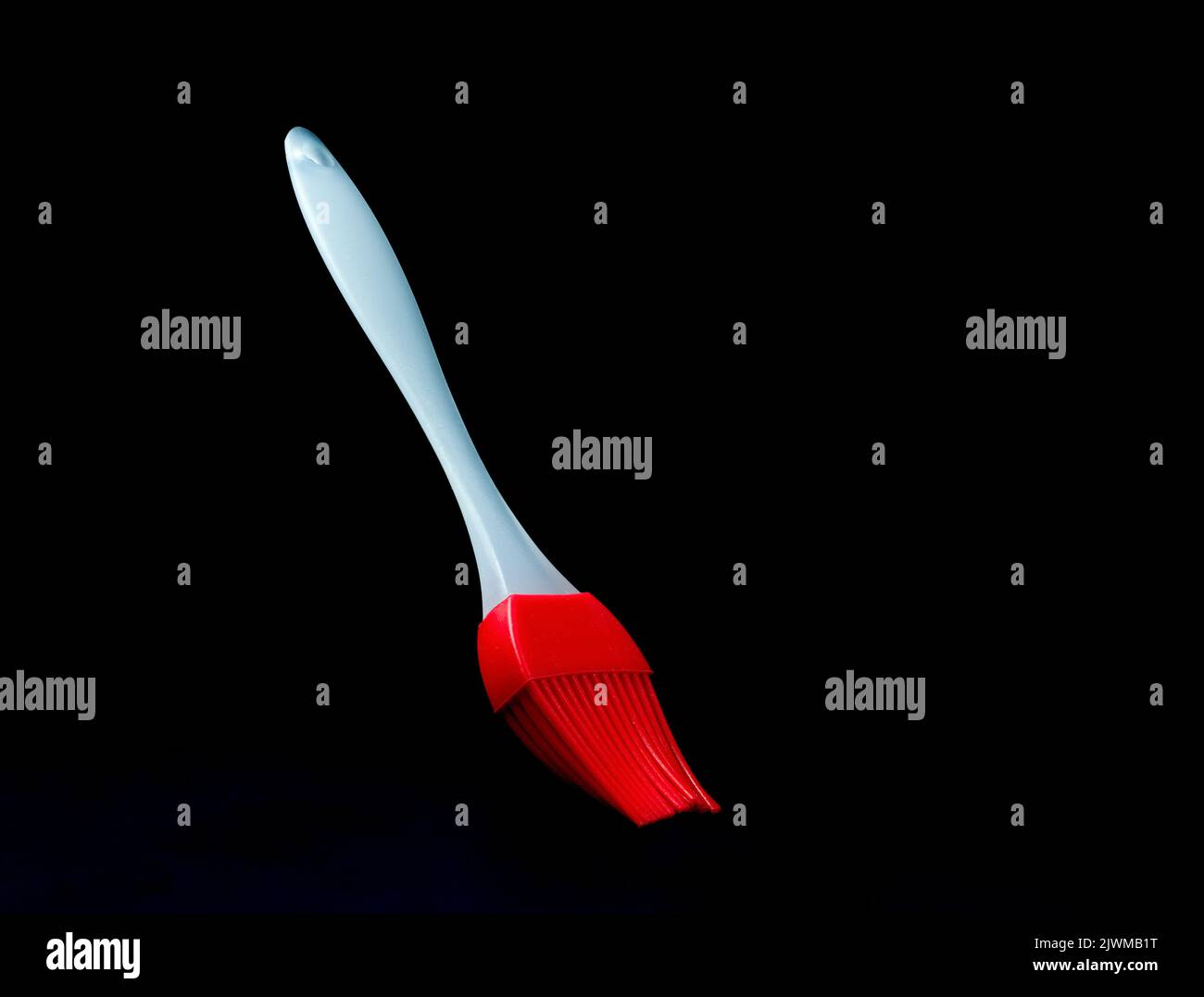 silicon basting brush on a black background Stock Photo