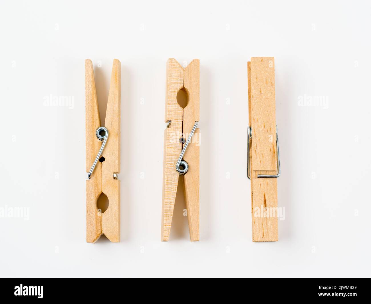 wooden spftwood pegs isolated on a white background Stock Photo