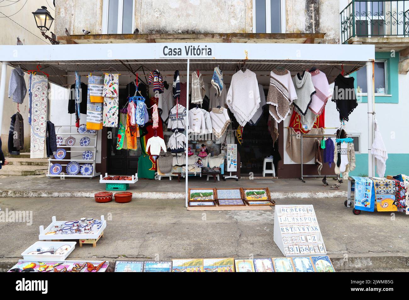 NAZARE, PORTUGAL - MAY 22, 2018: Local artisanal craft products and souvenirs in market stalls in Nazare, Portugal. Stock Photo