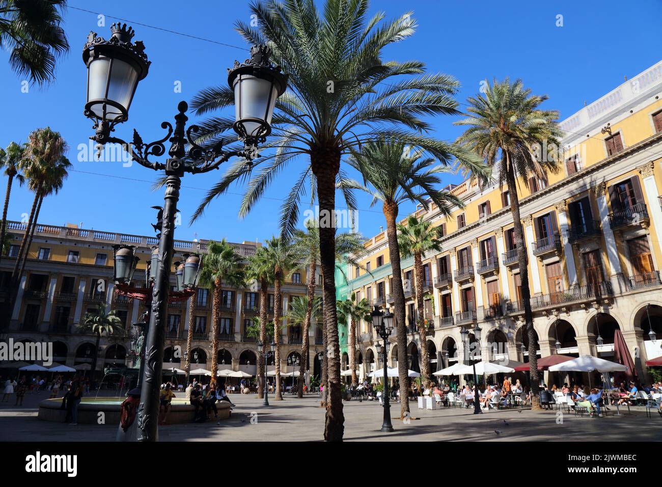 BARCELONA, SPAIN - OCTOBER 7, 2021: People visit  Placa Reial square in Barri Gotic district of Barcelona, Spain. Barcelona is the 2nd largest city of Stock Photo