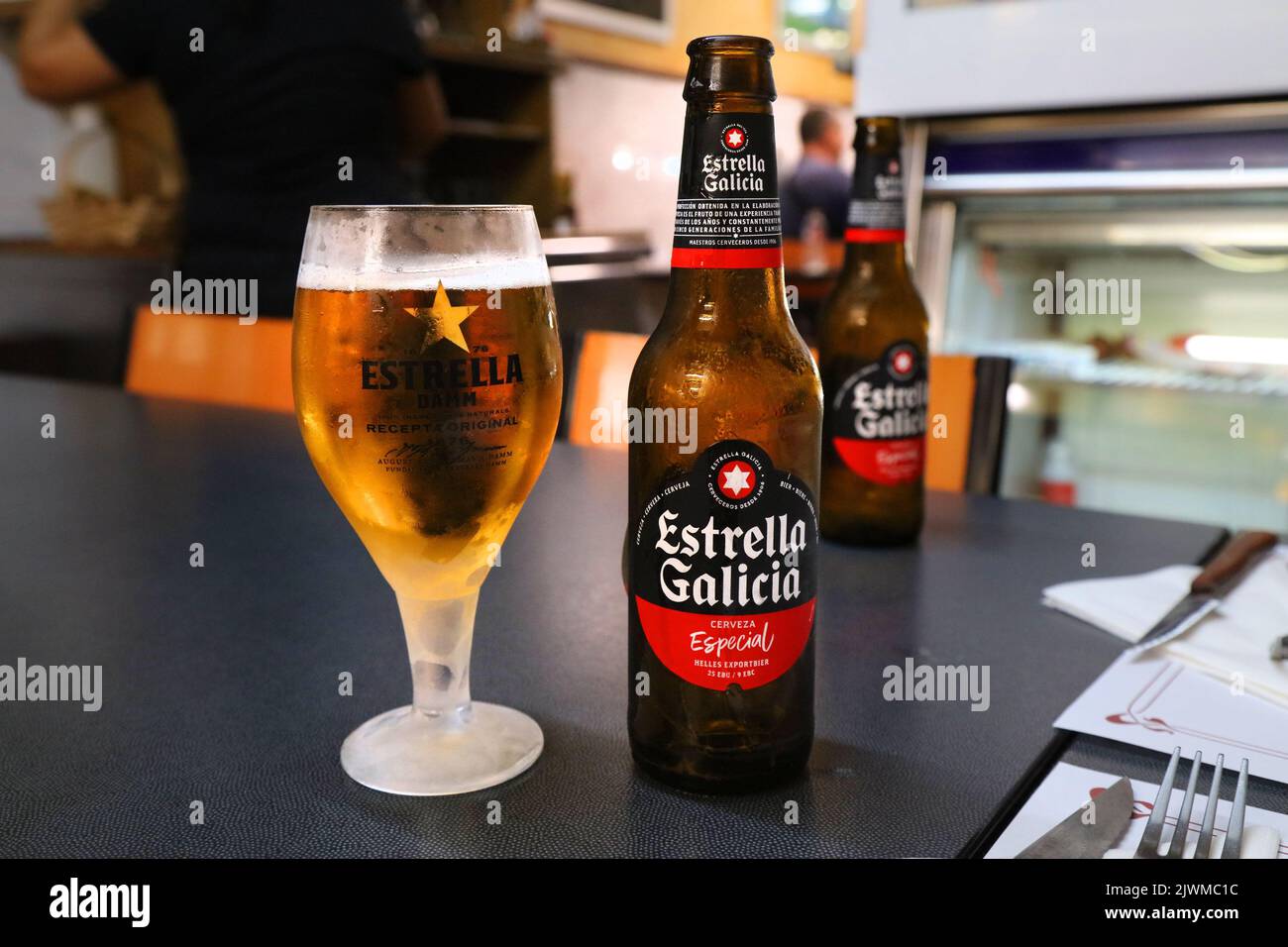 BARCELONA, SPAIN - OCTOBER 7, 2021: Estrella Galicia bottled beer in Barcelona, Spain. It is a pale lager brand of Hijos de Rivera Brewery. Stock Photo