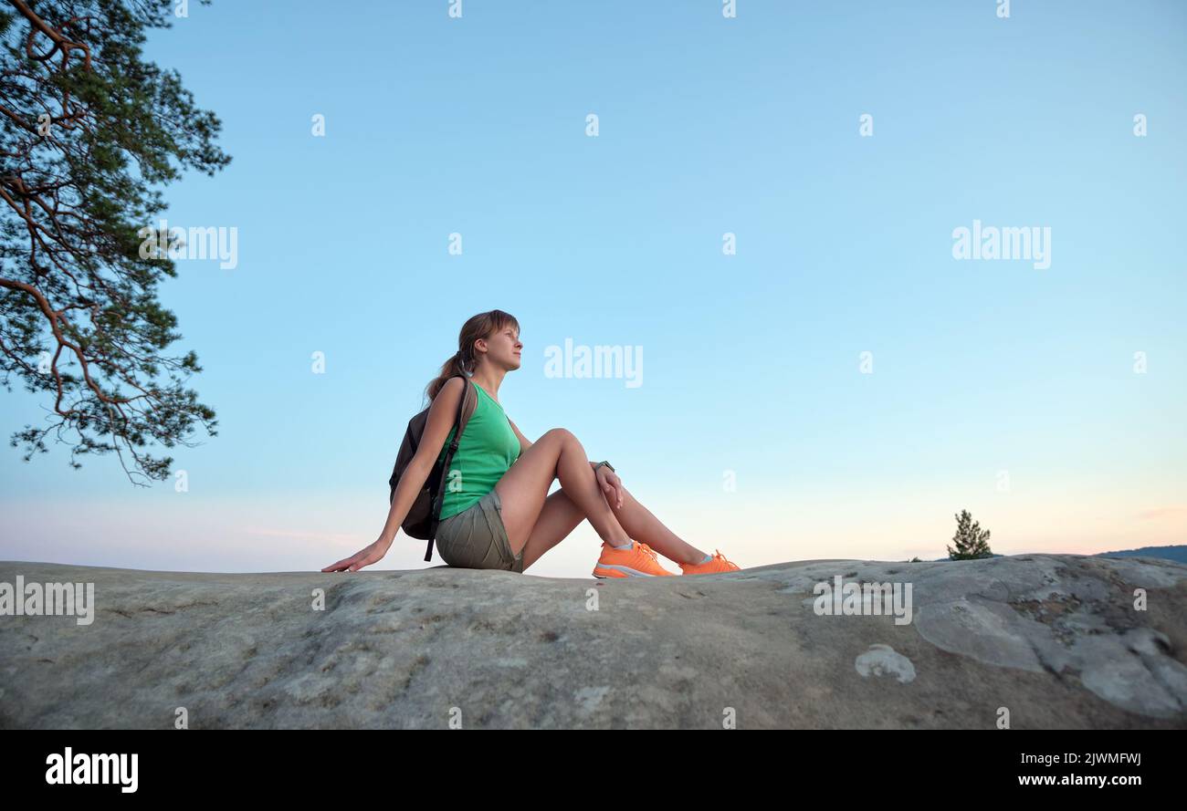 Girl sitting alone back nature hi-res stock photography and images