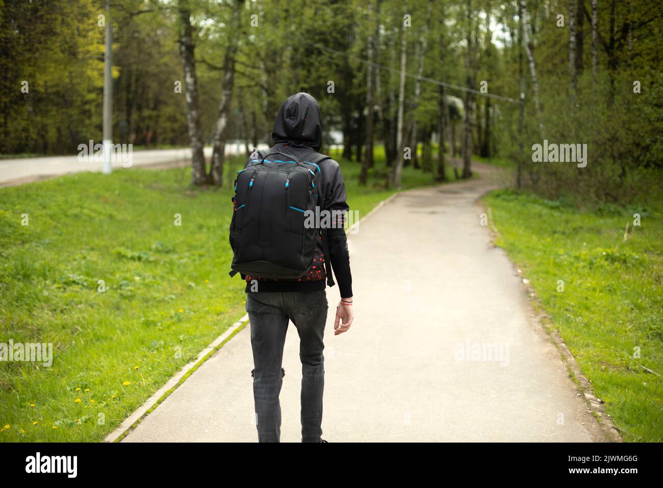 Back black man walking outside hi-res stock photography and images - Alamy