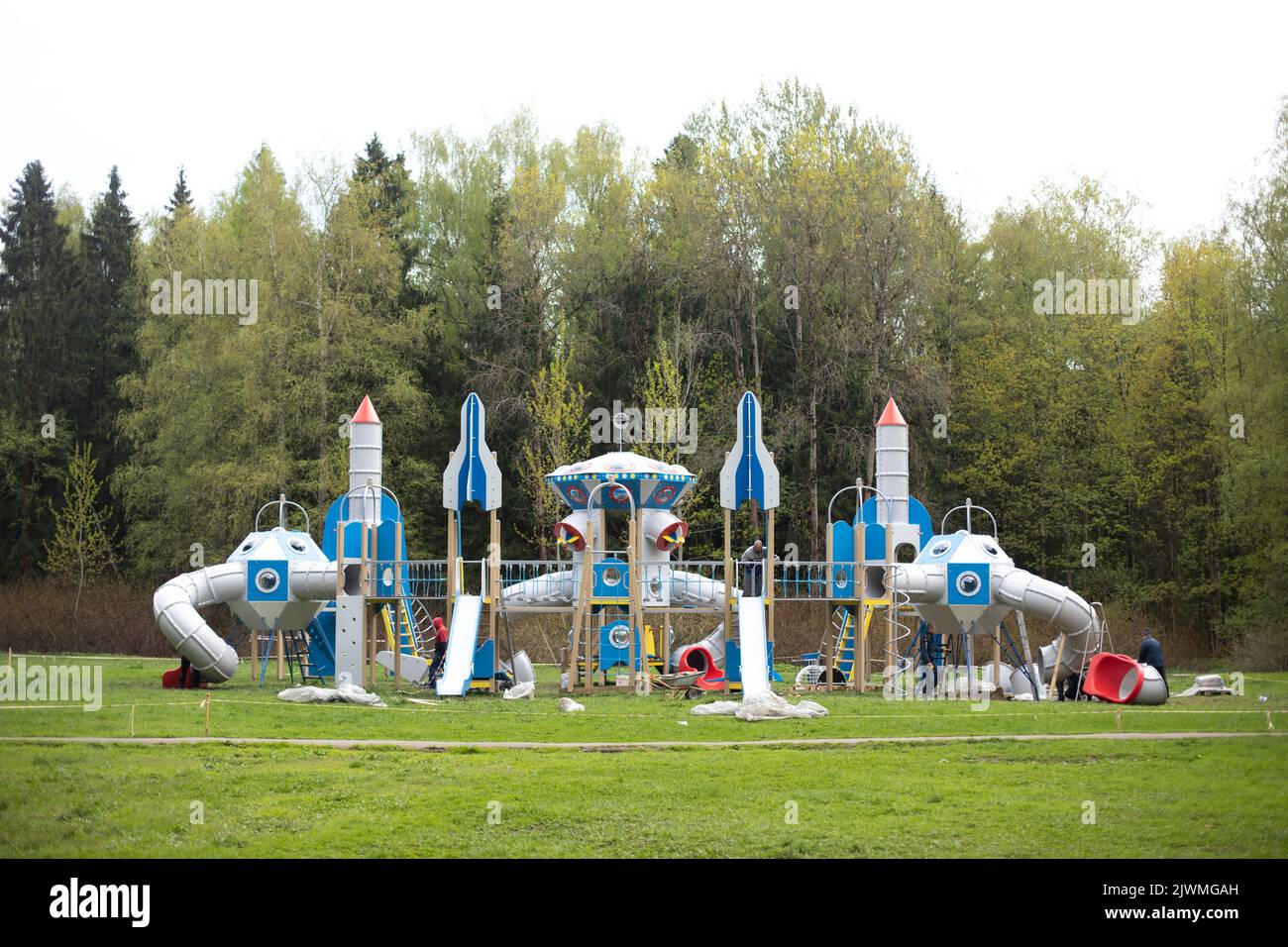 Large children's playground in park. Space station-style play area. Stock Photo