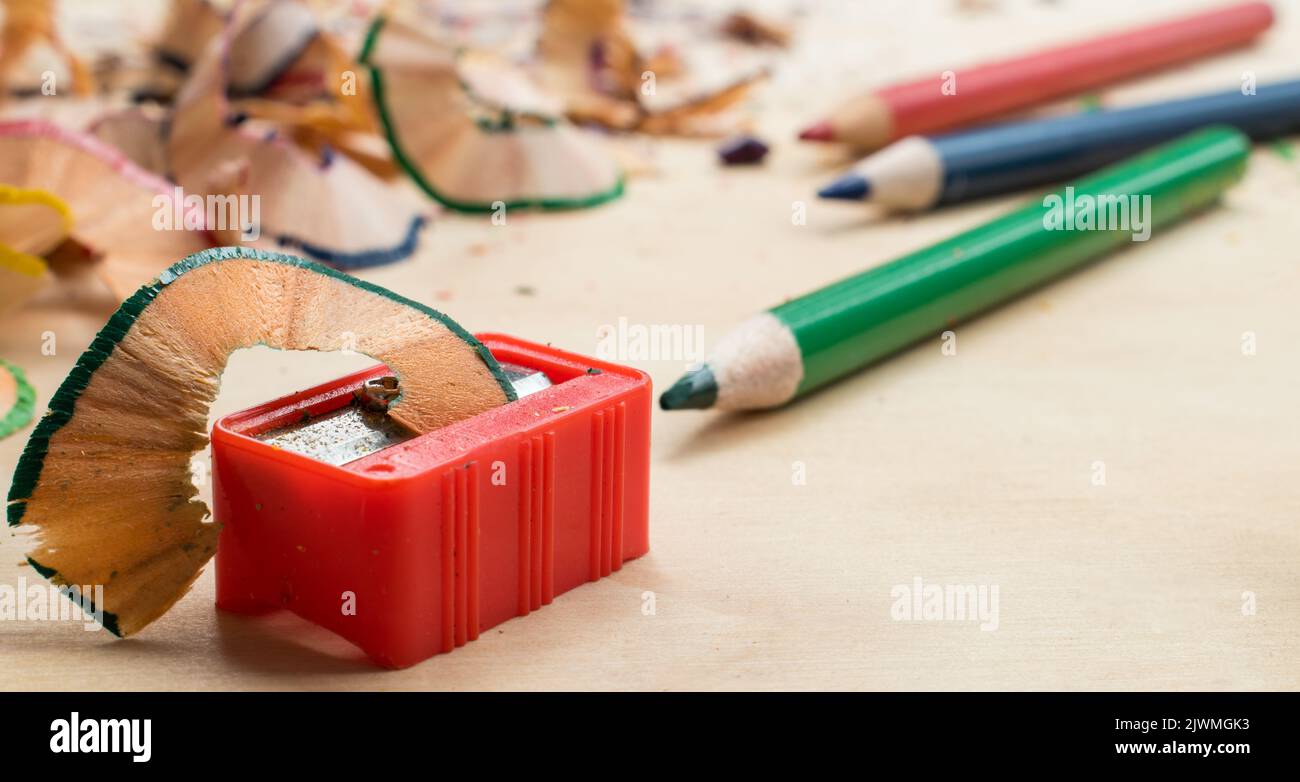 Plastic pencil sharpener and some colored pencils Stock Photo Alamy
