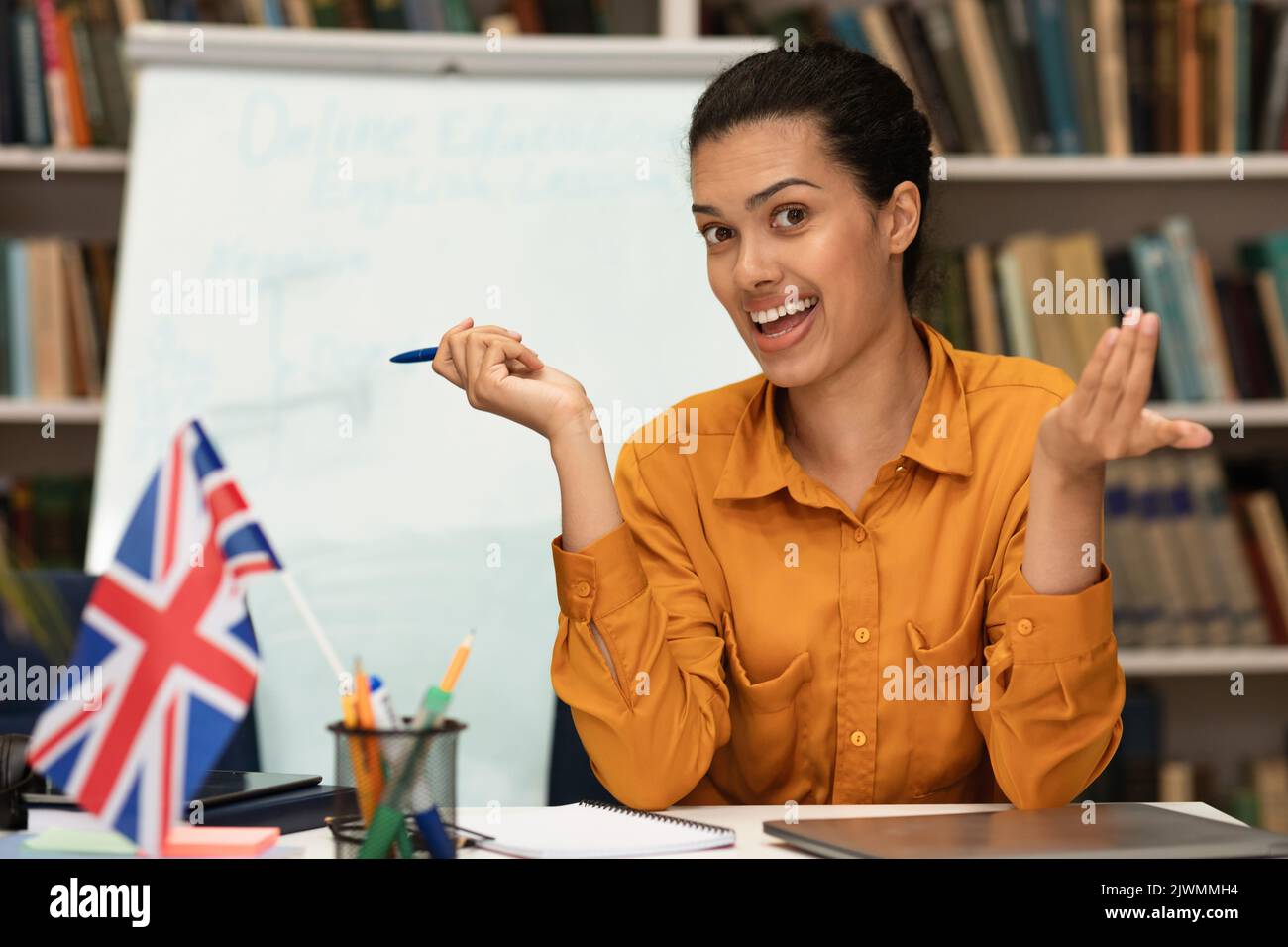 Online foreign languages tutoring. Friendly female teacher giving