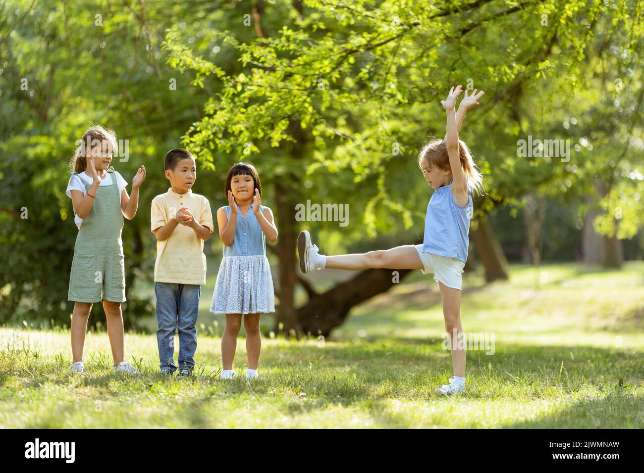 Group of cute asian and caucasian kids having fun in the park Stock ...