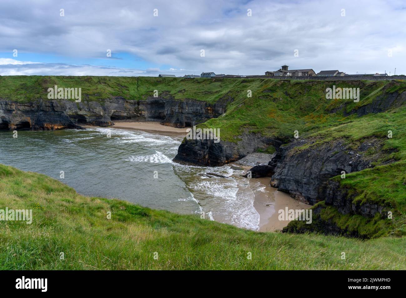 landscape of the Ballybunion Cliff Walk and rugged cliffs and seashore in County Kerry in western Ireland Stock Photo
