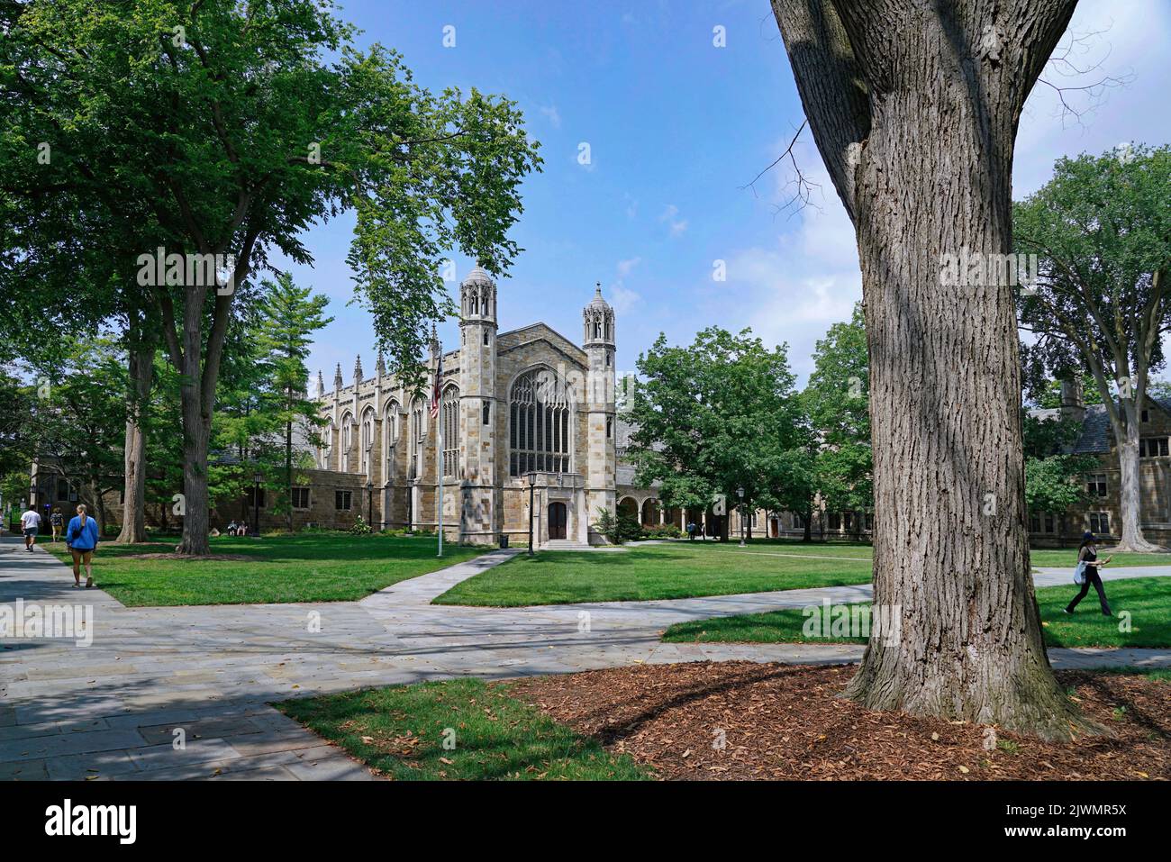 Ann Arbor, Michigan, USA - August 28, 2022:  University of Michigan campus with lawn and trees in front of gothic architecture buildings. Stock Photo