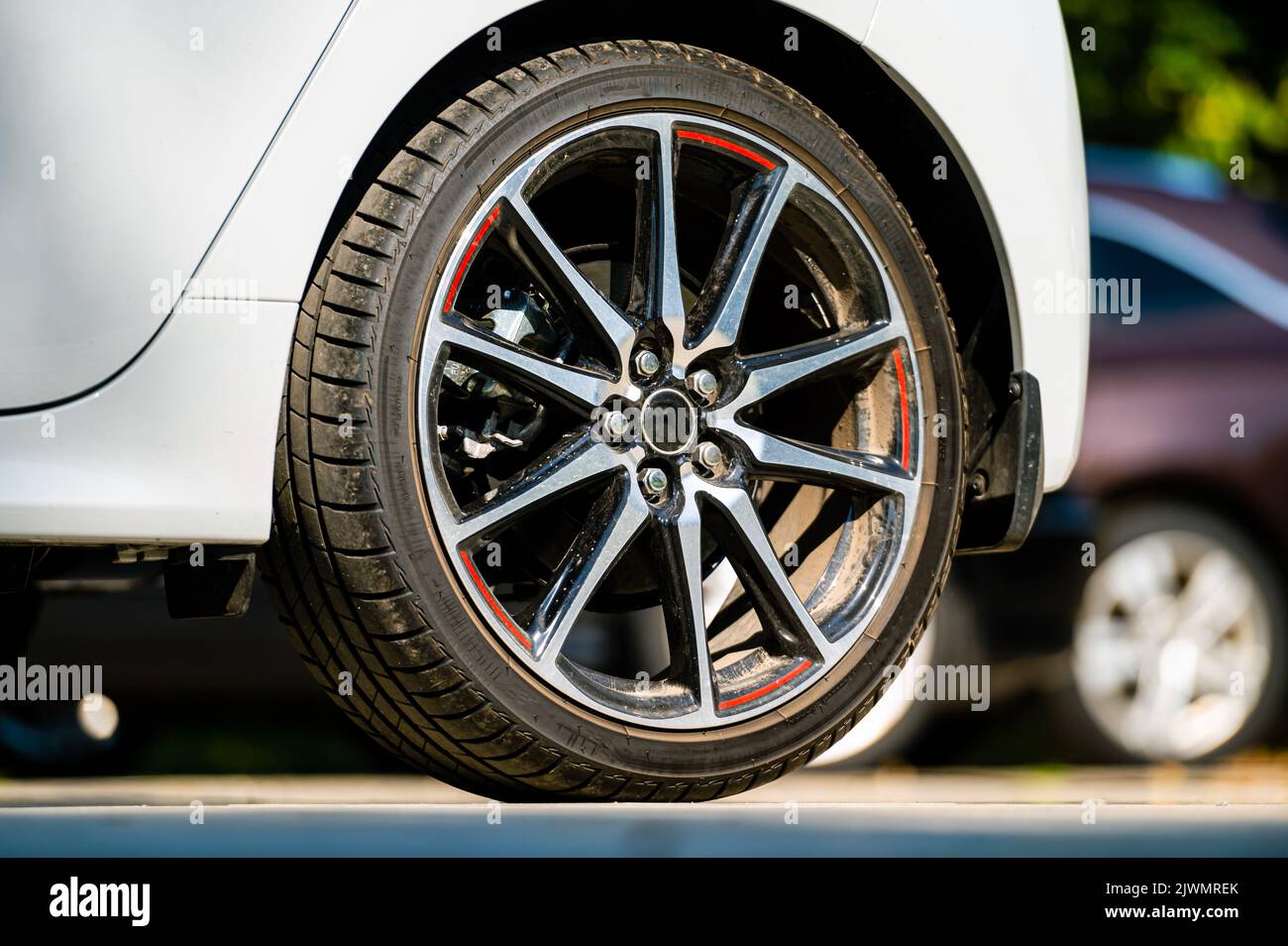 sports car wheels, low profile tires on aluminum rims, close-up ...