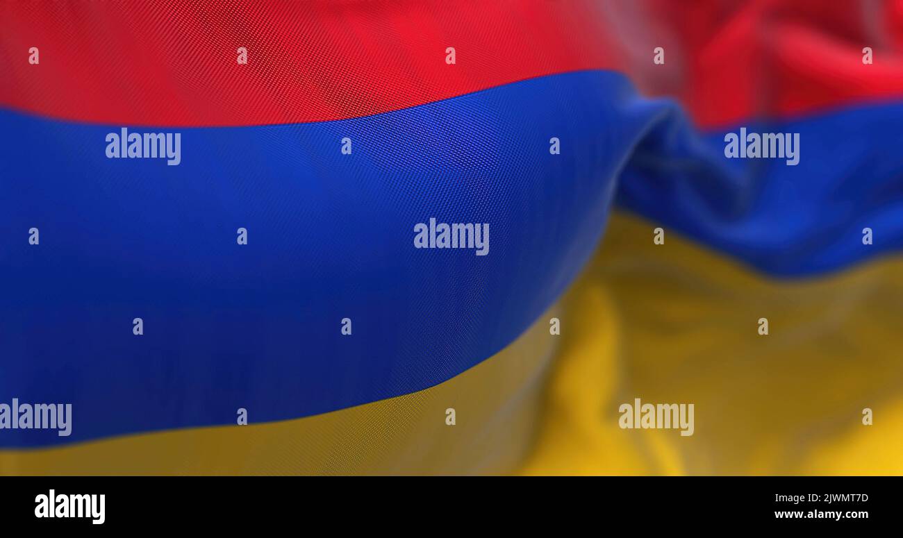 Close-up view of the armenian national flag waving in the wind. Armenia is a landlocked country located in the Armenian Highlands of Western Asia. Fab Stock Photo