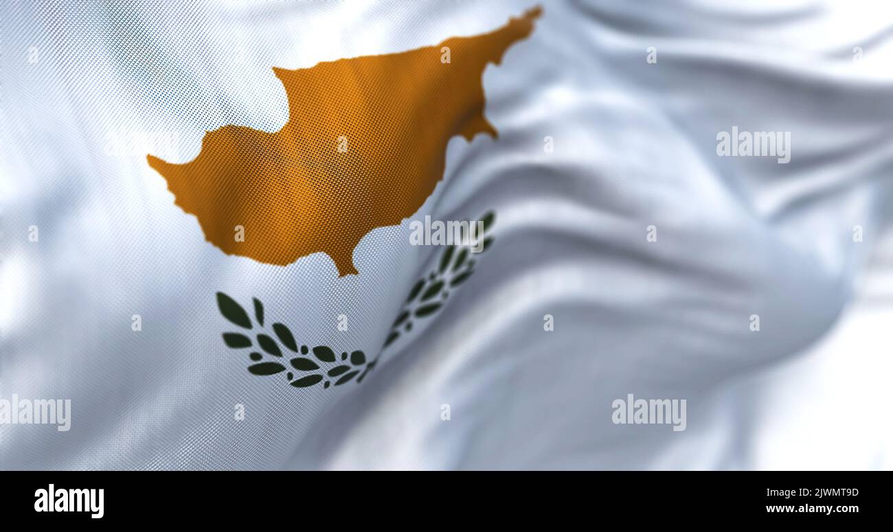Close-up view of the cypriot national flag waving in the wind. The Republic of Cyprus is an island country in the eastern Mediterranean Sea. Fabric te Stock Photo