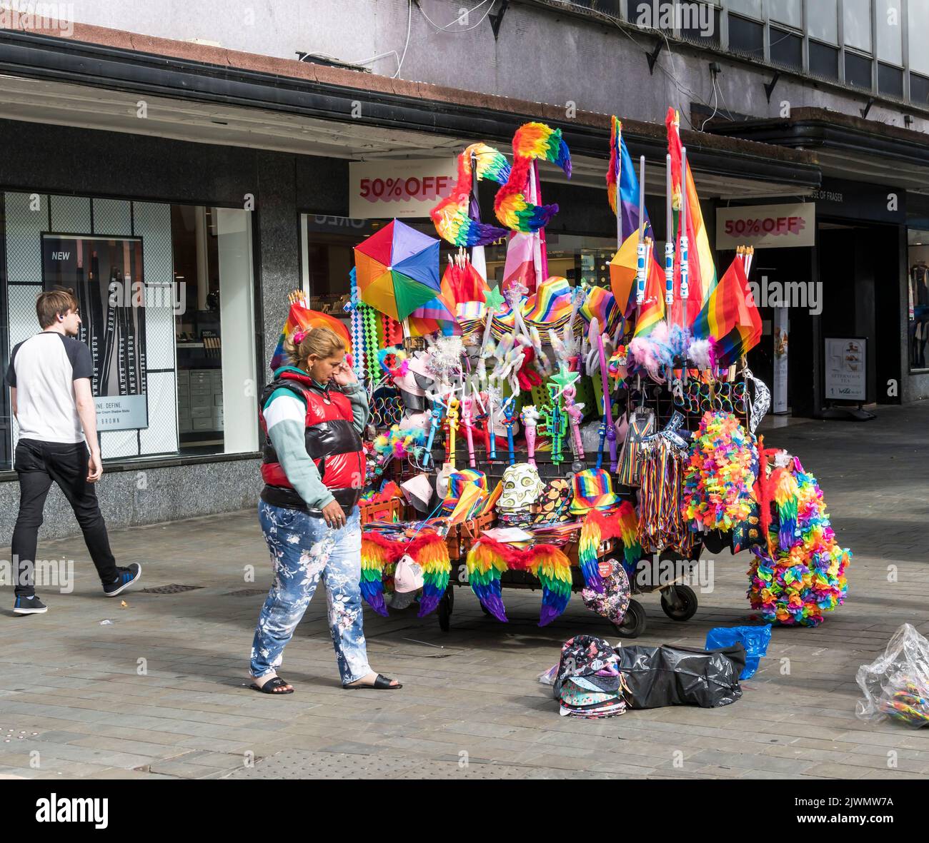Trader setting up stall for Lincoln Pride parade, High street Lincoln city 2022 Stock Photo