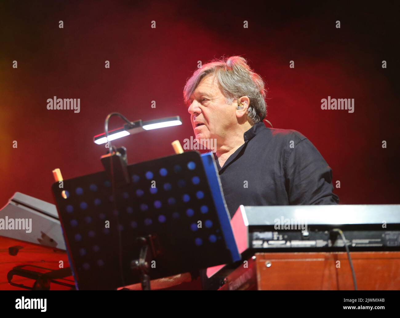 Vicenza, VI, Italy - September 4, 2022: Live Concert of an Italian band called NOMADI and BEPPE CARLETTI leader and piano player Stock Photo
