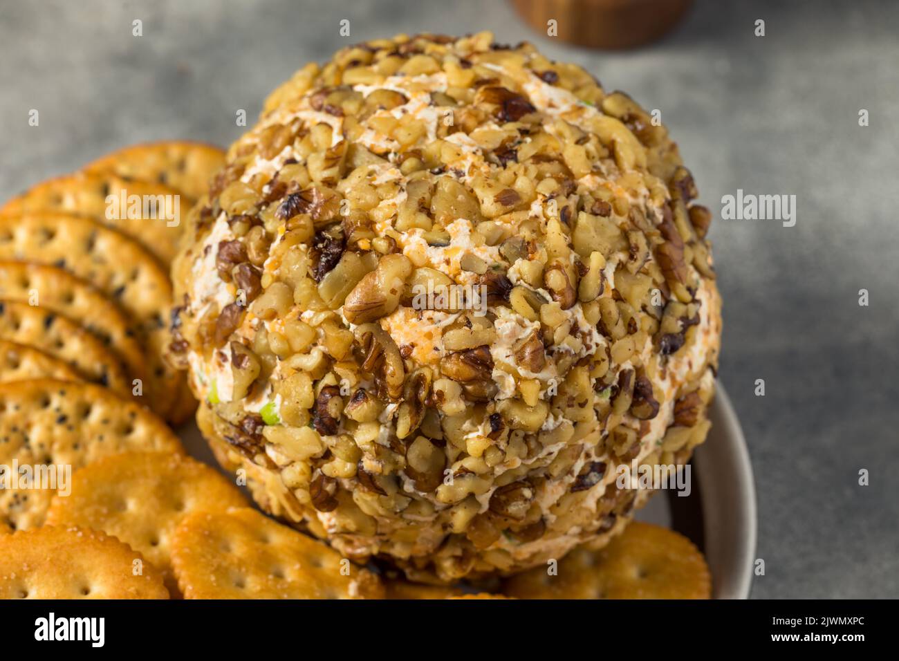 Homemade Creamy Cheese Ball Appetizer with Crackers Stock Photo