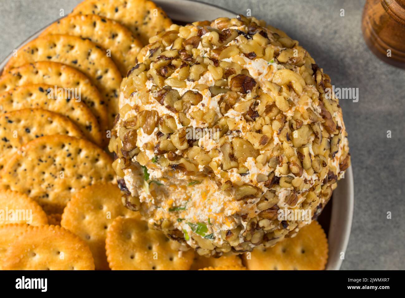 Homemade Creamy Cheese Ball Appetizer with Crackers Stock Photo