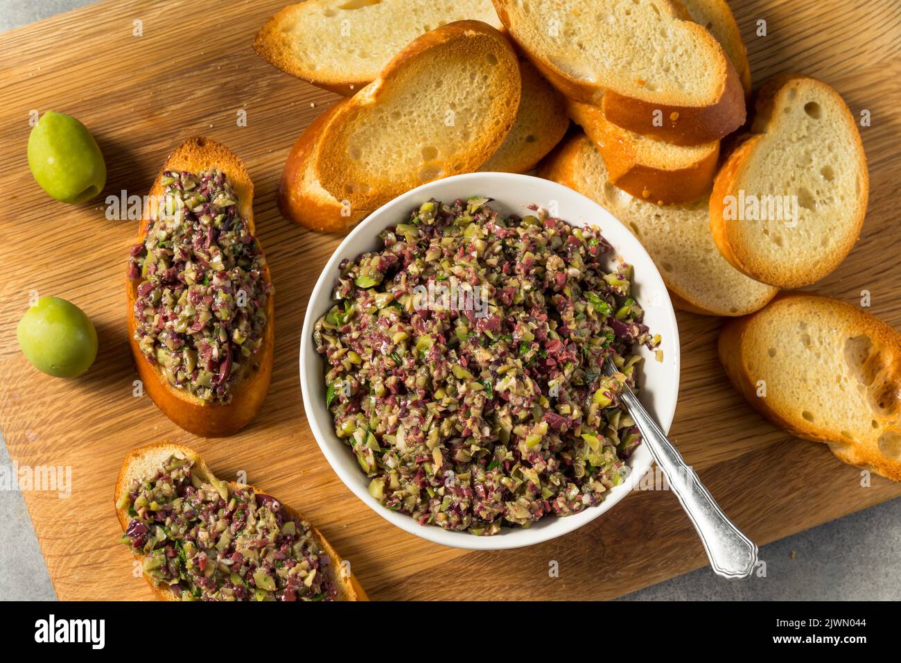 Homemade Mixed Olive Tapenade Appetizer with Toasted Bread Stock Photo