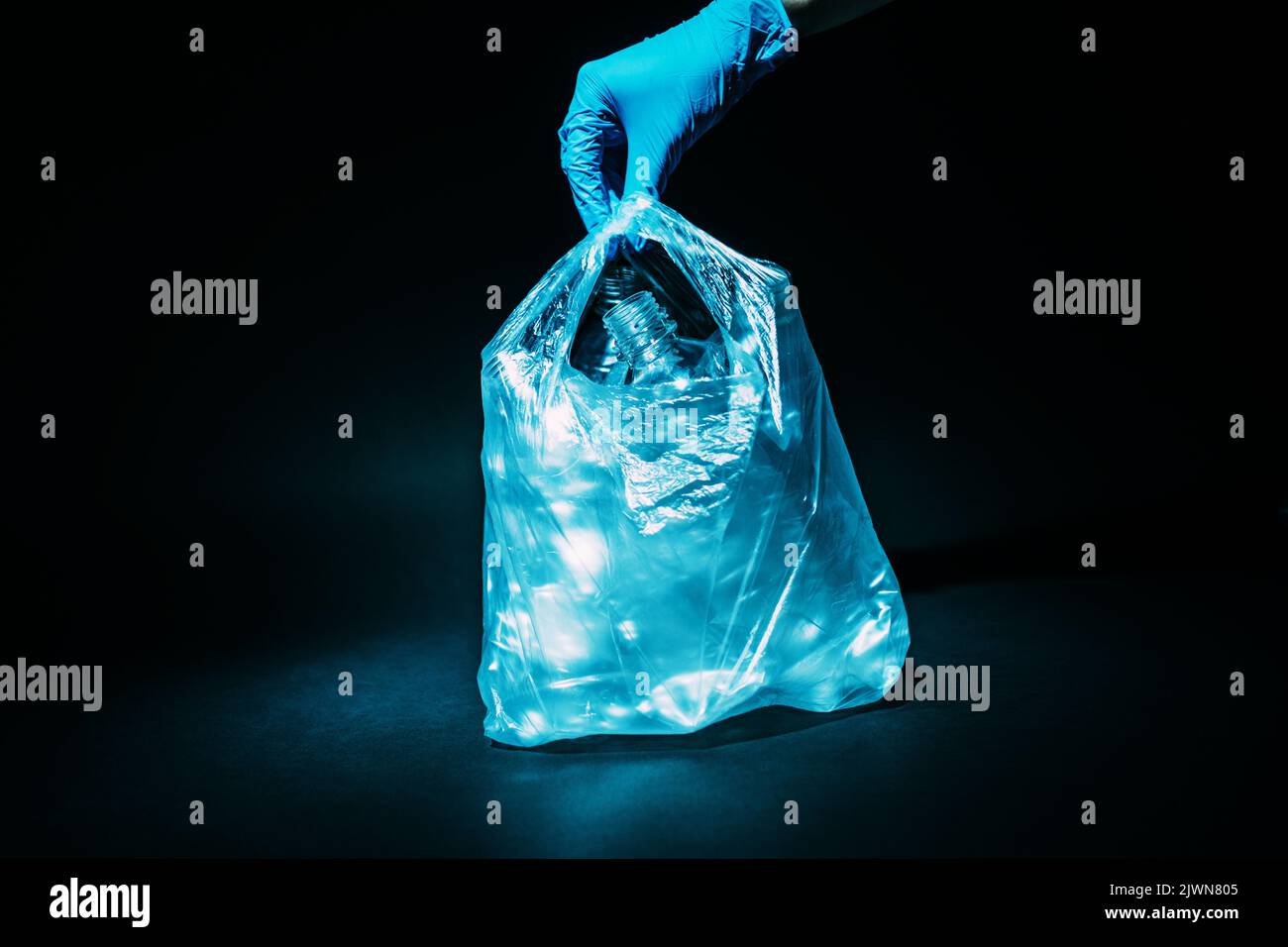 waste management plastic reuse hand bottles bag Stock Photo