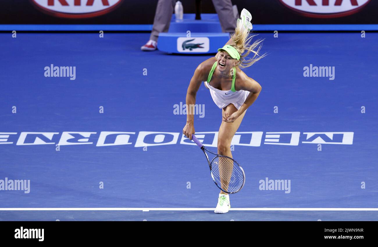 Maria Sharapova of Russia serves to Sabine Lisicki of Germany at the