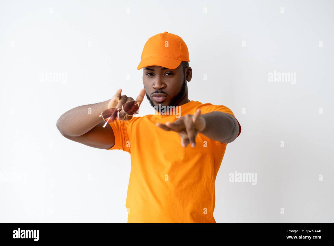cool african guy urban lifestyle orange outfit Stock Photo