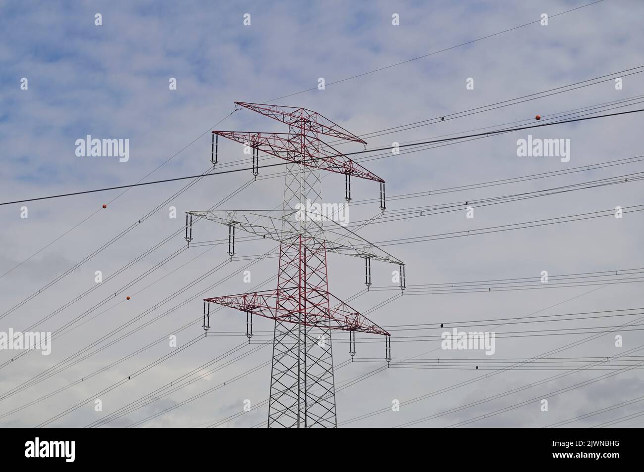 Steel lattice mast for the suspension of an overhead electrical line Stock Photo