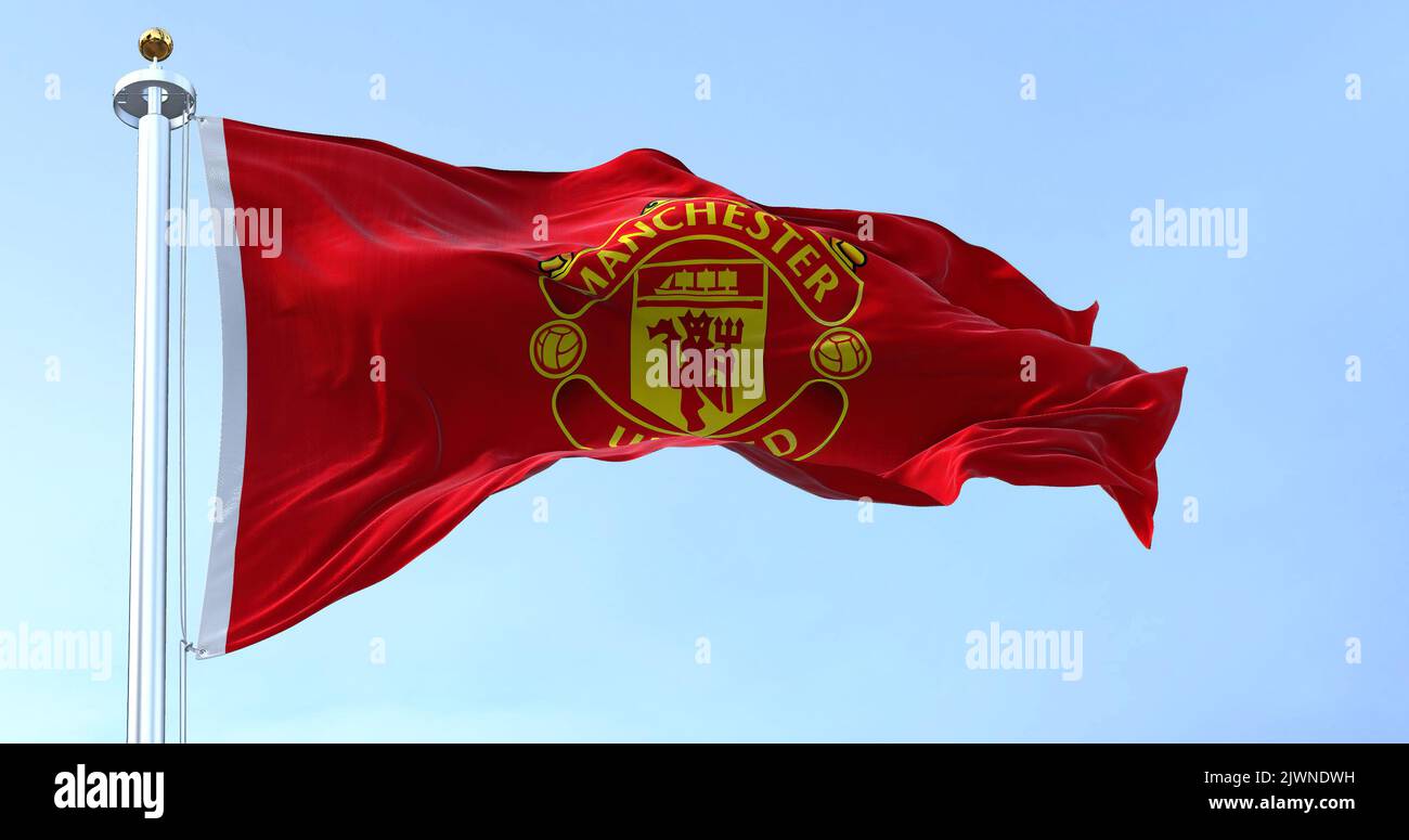 Manchester, UK, May 2022: The flag of Manchester United waving in the wind on a clear day. Manchester Football Club is a professional football club ba Stock Photo