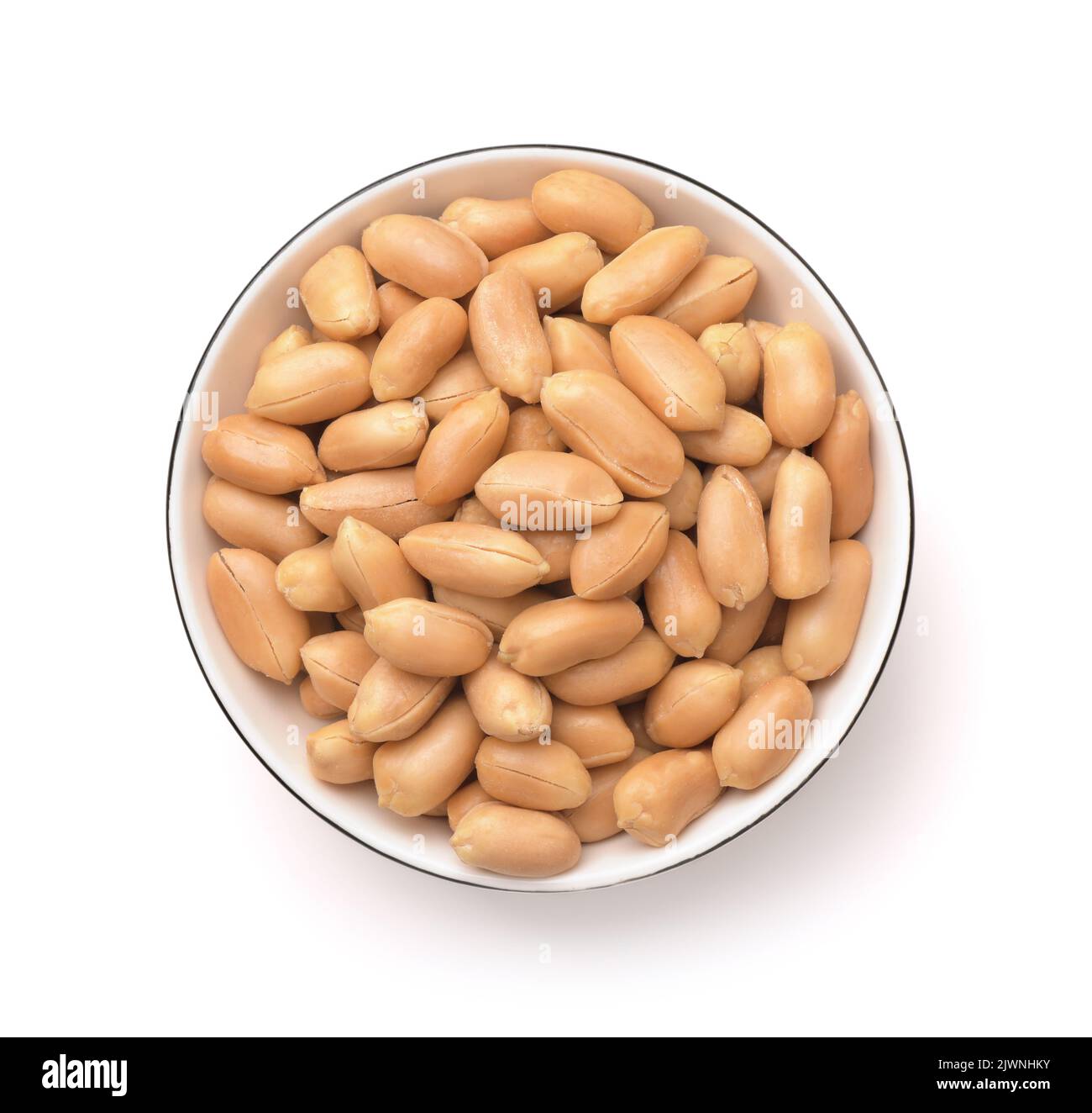 Top view of peeled roasted peanuts in ceramic bowl isolated on white Stock Photo