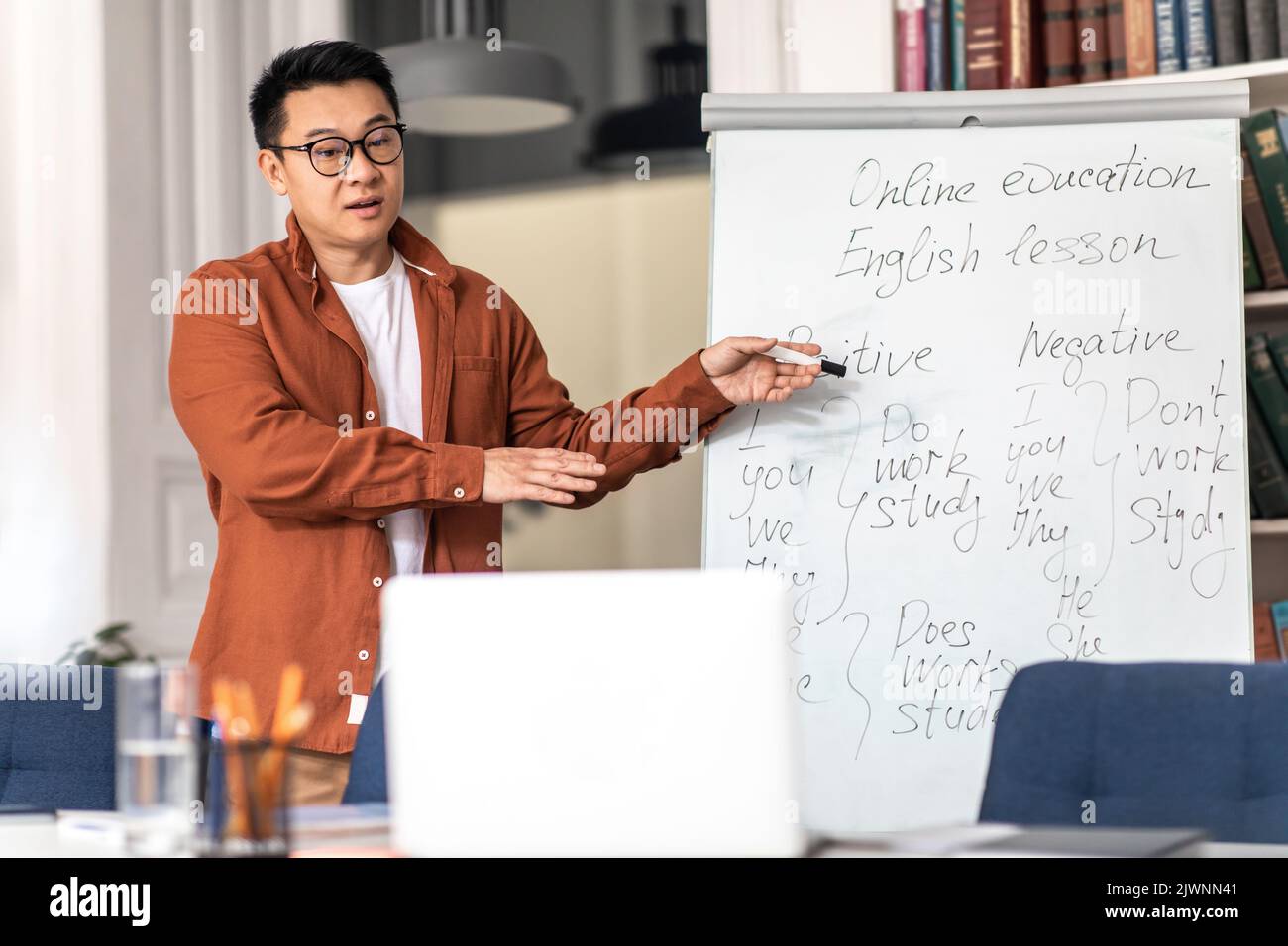 Chinese Teacher Man Having English Lesson Online Teaching In Classroom Stock Photo