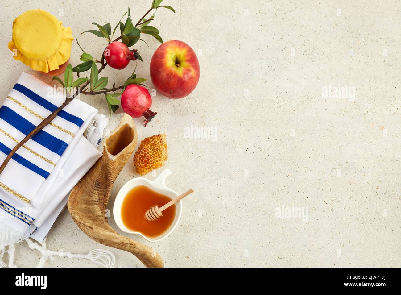 Rosh hashanah, jewish New Year holiday concept. Pomegranate, apples and honey traditional products for celebration Stock Photo