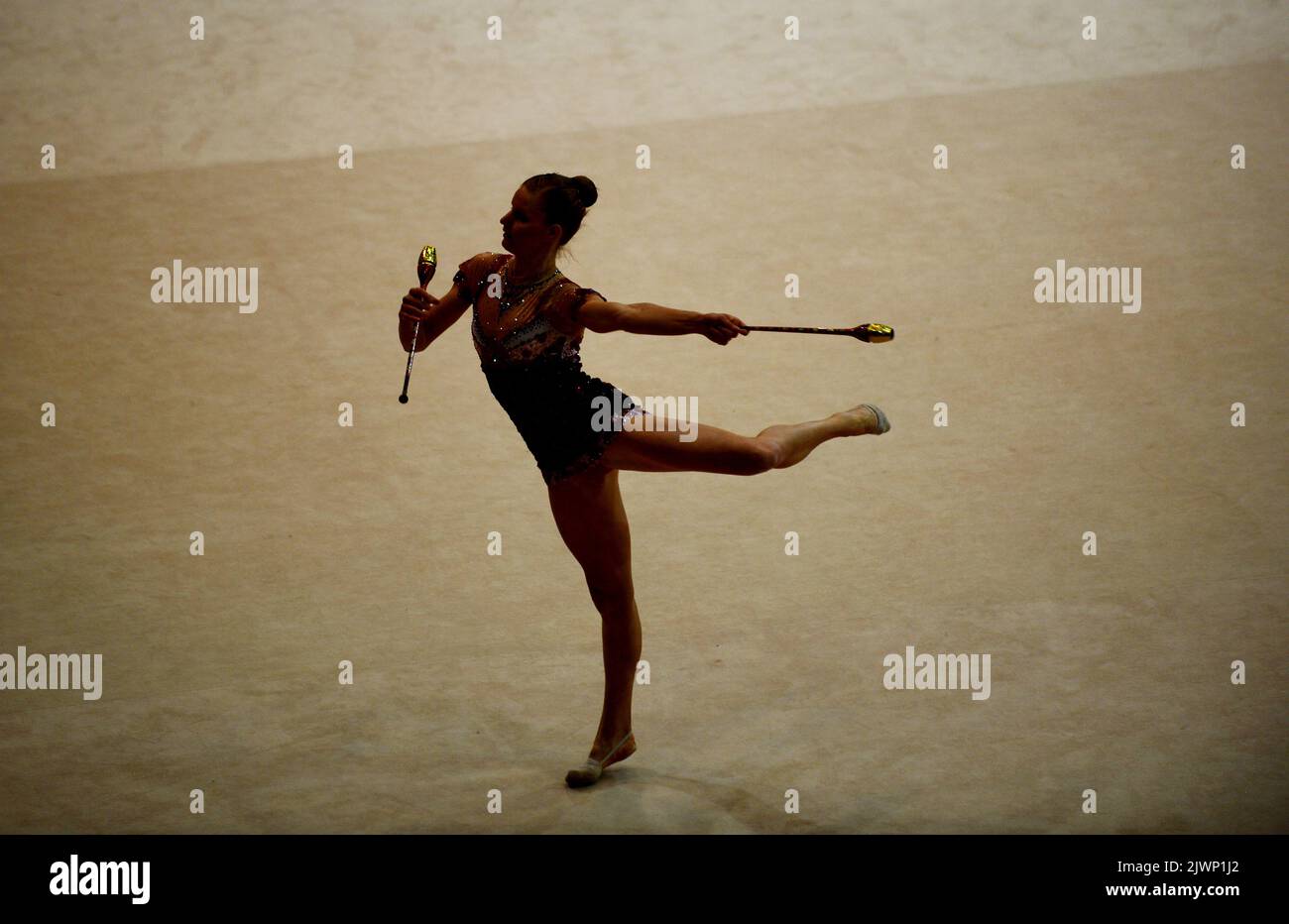 Australian rhythmic gymnast Janine Murray of WA competes with the clubs
