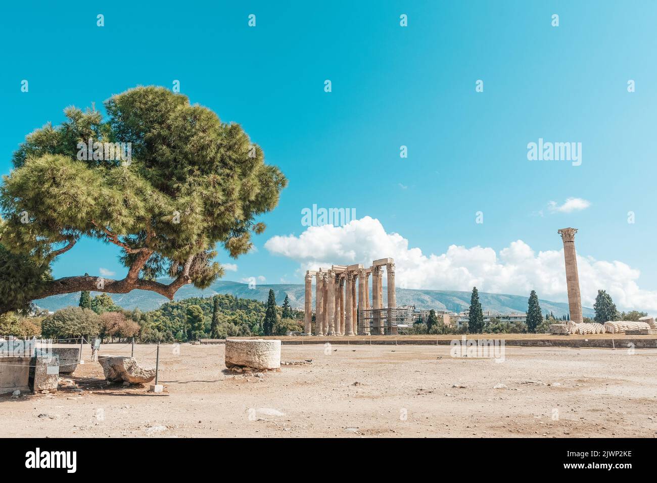 Acropolis, ancient Greek fortress in Athens, Greece. Panoramic image of Parthenon temple on a bright day with blue sky and faraway clouds. Classical G Stock Photo