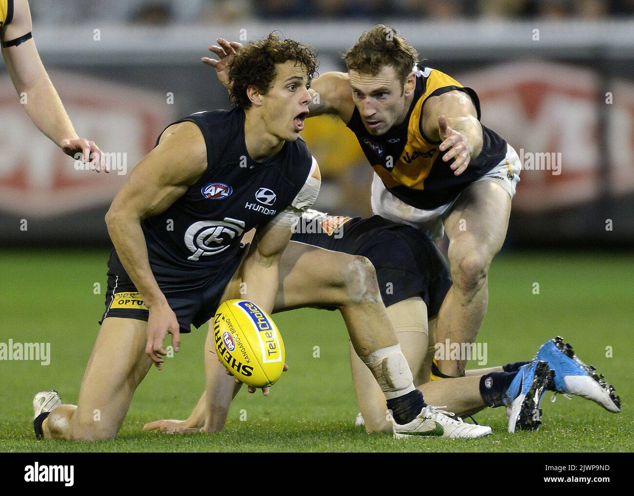 Ed Curnow of Carlton and Shane Tuck of Richmond in action during their ...