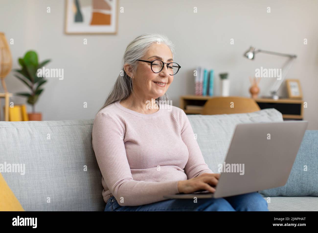 Hand senior woman typing hi-res stock photography and images - Alamy