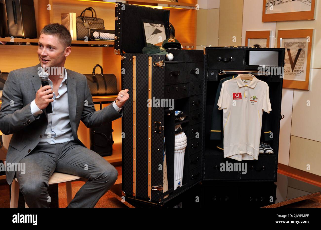 Australian cricket captain, Michael Clarke, gestures to a Louis Vuitton  cricket trunk in Sydney on Tuesday, Oct. 16, 2012. The trunk was designed  in collaboration with Clarke and will be auctioned with