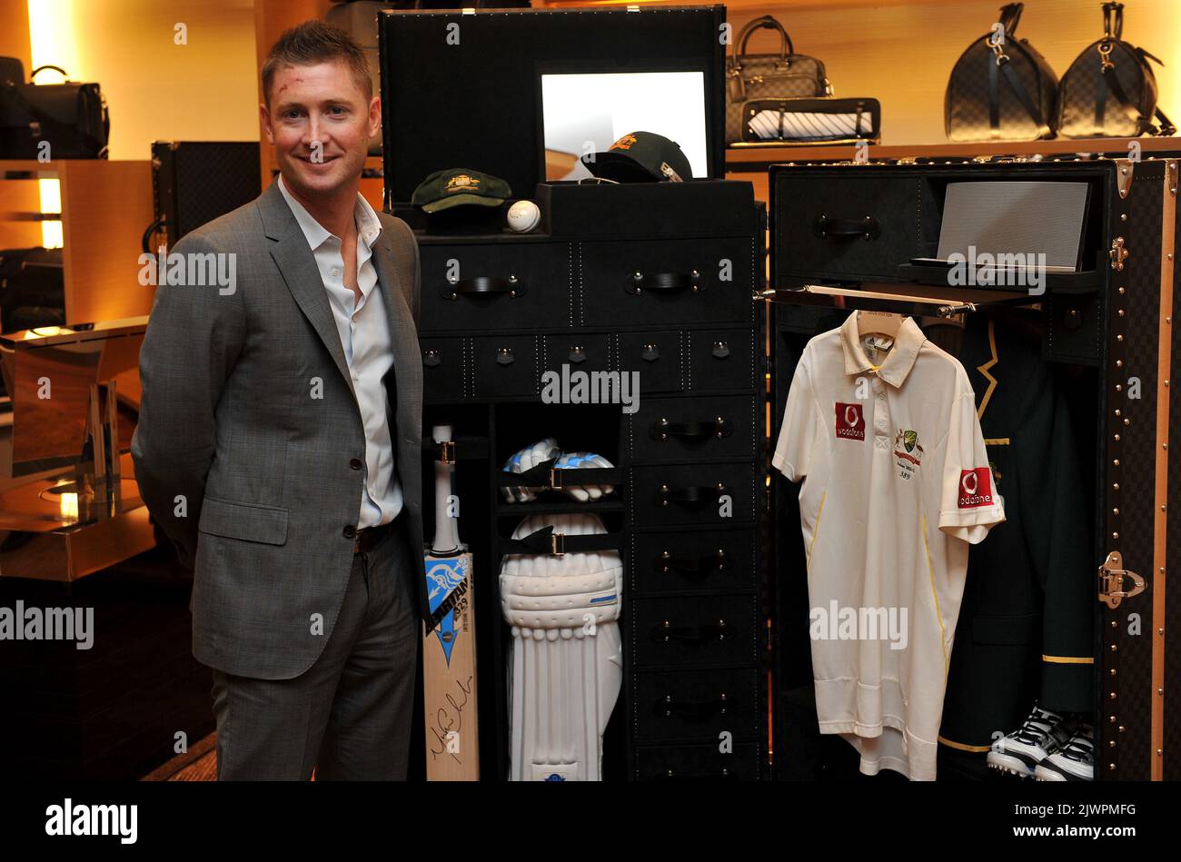 Australian cricket captain, Michael Clarke, poses for a photograph with a  Louis Vuitton cricket trunk in Sydney on Tuesday, Oct. 16, 2012. The trunk  was designed in collaboration with Clarke and will