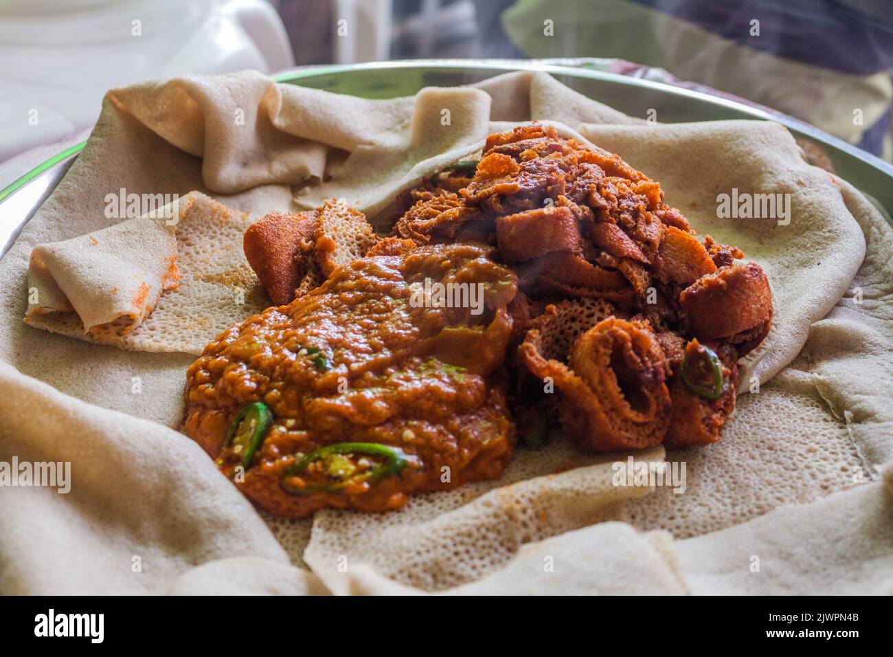 Breakfast in Ethiopia - injera with shiro sauce and injera fir fir Stock Photo