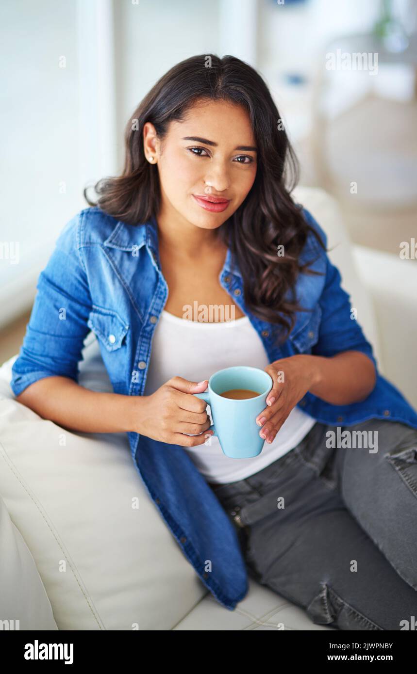 Start your weekend with a fresh cup. a young woman drinking coffee