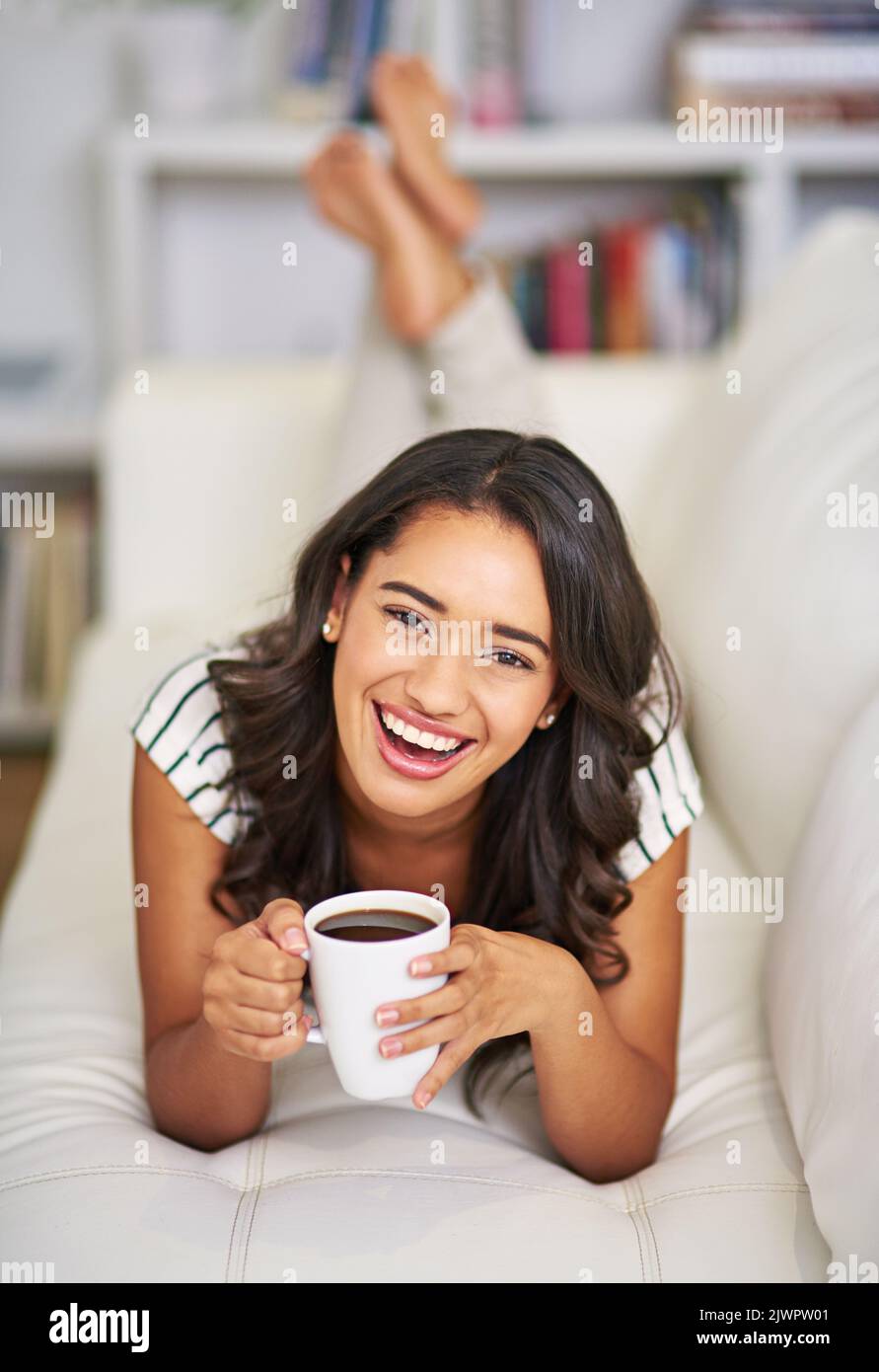Coffee comforts me. Full length portrait of a young woman drinking ...